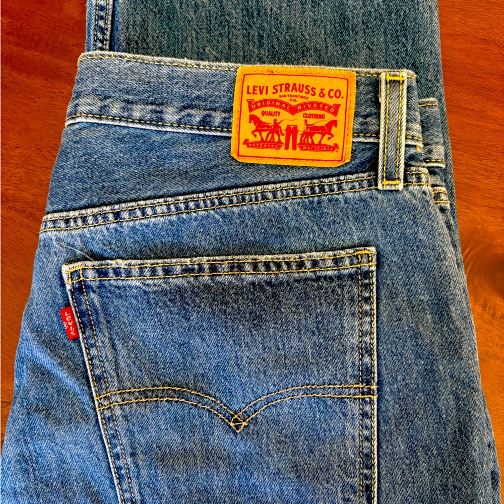 Levi’s Low Pro Straight Jeans Size 32 100% Cotton Destructed with holes in knee.